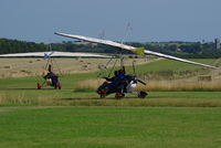 - Two micro-lights about to depart from Northrepps. - by Graham Reeve