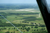  - Huffman Prairie located on Patterson Field.  5 white flags depict the path of the Wright Bros flying machine.

Shot from NC9119. - by Allen M. Schultheiss