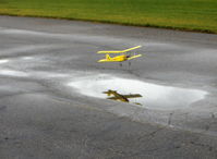  - Rick's Tiger Moth RC drone puddle jumper, reflected in flight - by Doug Robertson