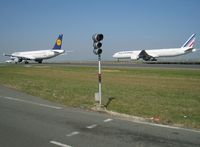  - Coming through Alpha Loop, LH A321 D-AIRU tries getting the best over AF 773 F-GSQV while on hot competition for reaching runway 09R. Emerging from Bravo Loop, the Big Boeing won... - by Alain Durand
