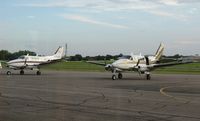  - A pair of Bemidji Aviation Queen Airs on a Friday night. - by Kreg Anderson