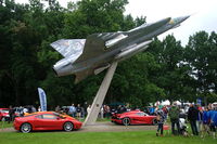  - This Saab j35J Draken is positioned on a pole in the Valhall Park of the airfield. The sportscars were parked below it for the Lergökarraly 2011. - by Henk van Capelle