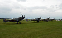  - SPITFIRES ON THE FLIGHTLINE ON A VERY DULL AND RAINY DAY. - by Martin Browne