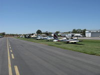 - James 'Seamus' McCaughley, Jr. Memorial-some of the fly-in aircraft parked on 22L grass - by Doug Robertson
