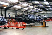  - lineup of Bell 206 Jetrangers in the Tiger Helicopter's hangar at Shobdon - by Chris Hall