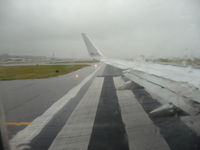  - Raining on the taxiway. - by Gary Barnes