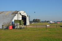  - ACROSS THE MAINT HANGAR. - by Martin Browne