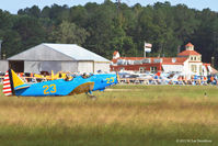  @ Sussex County Airport - Sussex County Airport Terminal in background as Fairchild M-62 taxis before take-off. - by M. Lee Derrickson