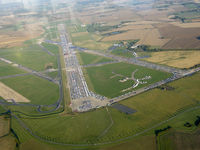  @ EGVW - RAE Bedford, Thurleigh. Now disused however part of the runway is still used by aircraft in attendance in relation to bedford autodrome. Vehicles are now stored on the disused runway. - by Ashley Flynn