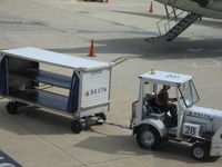  - Tug # 28 Delta baggage cart - by Ronald Barker