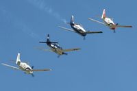  - T-28 flight overflying Airventure 2011. - by Bob Simmermon