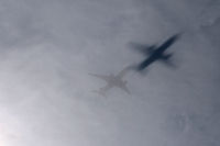  - Interesting shadow on the low thin cloud cover...on approach to DFW. - by Zane Adams