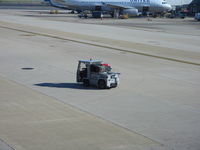  - Tug # 143 with luggage - by Ronald Barker