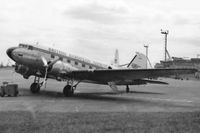  - An unidentified BEA Douglas C-47 Royal Mail aircraft at Heathrow Airport, London in 1955. In the background on the right is the Queens Building, the roof of which was a favourite spectator location. - by Harry Longden