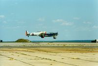  - North American AT-6 Texan N44999 and 1958 North American SNJ-5 N3687F at Quonset State Airport, North Kingstown, RI - circa 1980's - by scotch-canadian