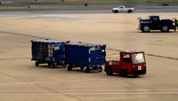  - Red tug # 59045 with bags - by Ronald Barker