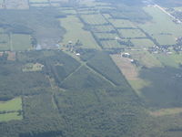  - Looks like someone gave up on the cross runway as it's too narrow, but the one looks good except for the trees on both sides. - by Peter Pasieka