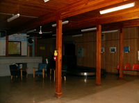  - Miramichi Airport terminal. That is a luggage carousel in the corner. Didn't look like it was used much nowadays.  - by Peter Pasieka