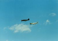  - 1944 North American P-51D N51U Passion Wagon and 1944 North American P-51D N51EA Double Trouble at Quonset State Airport, North Kingstown, RI - circa 1980's - by scotch-canadian