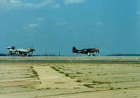  - 1944 North American P-51D Mustang's N51EA and N51U at Quonset State Airport, North Kingstown, RI - circa 1980's  - by scotch-canadian