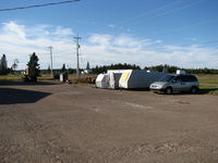  @ CCQB - Gliders packed away wait for another day at the Debert Airport - by Peter Pasieka