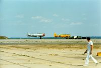 - North America AT-6 Texan N6984C and North American AT-6 Texan 51-14987 at Quonset State Airport, North Kingstown, RI - circa 1980's - by scotch-canadian