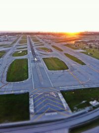  - Sunrise over Runway 9L - by PETER CLOSI