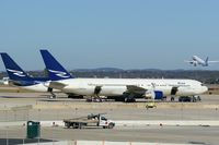  - N123DN (foreground) & N125RD parked at west cargo area waiting on the University of Washington football team and others headed back after the Alamobowl previous night - by RWB