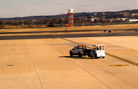  - Tug being towed by pickup truck - by Ronald Barker