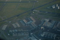  - Amsterdam airport, Schiphol, seen from a KLM 777-300 while overflying. Lots of KLM aircraft and the tower are to be seen. - by Henk van Capelle