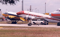  - Yellow plane is N50E , cn 11657  DC-3A

Red plane is  N212DD , cn 43389  C-117D

Nose  N381AA , DC-7BF  cn 44921 - by Henk Geerlings