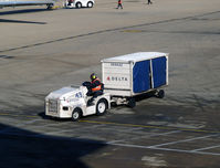  - Tug 43 with baggage cart - by Ronald Barker