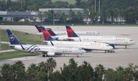  - Five Delta planes hardstanding at Airside 2 as they ran out of hardstands at Airside 4 due to cancellations from Hurricane Irene - by Florida Metal