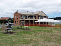  - Peninsula Aero Club building from another angle, showing barbeque area and preparations for the airshow on Sunday, March 4. - by red750