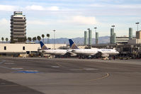  - A pair of United Airlines aircraft parked at Terminal 8. The control tower on the left was in use from October 1962 to April 1996. - by Dean Heald