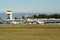  - Look over the fence shows control tower and on tarmac are visible two DHC-8-402Q airplanes from Croatia Airlines fleet - by Ivan Krpan