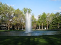  - Park like setting of main entrance drive. - by John S. Anderson