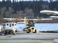  @ Kenmore Air Harbor Inc Seaplane Base - a Beaver is being beached and taxied by forklift at Kenmore Air Harbor - by Ingo Warnecke