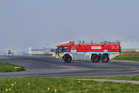  - Liverpool Fire Service tender 1 on taxiway with light aircraft and airport terminal building in background.   - by Mark J Kopczewski