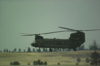  - The chinook with number 124 hovering while another chinook taxi's to park @ KBIL. - by Daniel Ihde