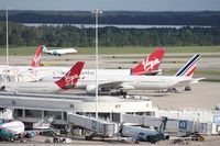  - Busy Saturday at MCO - all international gates occupied - Gate 81 - Virgin A330, 83 - Air France 777, 85 -Virgin 747, 87 - Virgin 747 84 (not pictured) Lufthansa A340-600, 82 (not pictured) Virgin A330, 80 (not pictured) British 777 - by Florida Metal