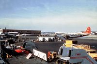  @ Indianola Municipal Airport - Photo taken by family member in the mid 50s. In picture left NATIONAL DC-7, right NORTHWEST Boeing 377-10-30 / Stratocruiser. Scanned from old diapositive. The airport has been identified as New York's Idlewild ( IDL ) airport. - by Jean M Braun