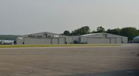  - North Coast Air's hangars at KERI.  - by aeroplanepics0112