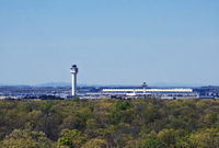  - The famous terminal by Eero Saarinen can be seen adjacent to the new control tower. - by Daniel L. Berek
