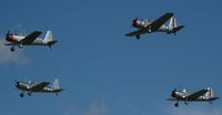  - 4 Vultee BT-13 Valiants doing a flyover at the 2012 Ray Fagen Memorial Airshow. - by Kreg Anderson