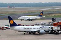  - Preparations at gate 10, lining up for rwy 05R and an arrival on rwy 05L on one pic. - by Holger Zengler