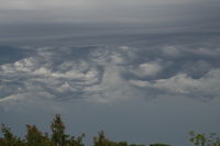  - Unusual clouds today.  I took this photo from my driveway, 1/4 mi. E on Hwy 67 of parachuters coming down with weird clouds in background.  - by Becky Thompson, 4835 E ST RD, Beloit