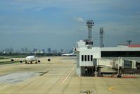  - Due to congestion of BKK airport, several airlines will set up again their hub at DMK. Bangkok skyline in background of photo. - by Jean M Braun