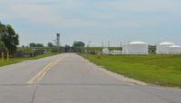  - A view beyond the fence of a fuel farm, ATCT, and one of three tunnels at KBUF.  - by aeroplanepics0112
