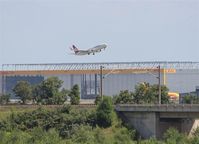  - View to DHL hangar and outbound traffic on rwy 26L.... - by Holger Zengler